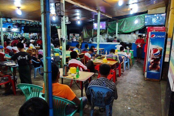 Local people watching TV in teashop