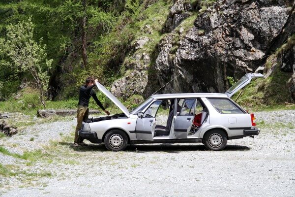 Old Renault on the top of tallest gravity dam in the world - Dixence Dam