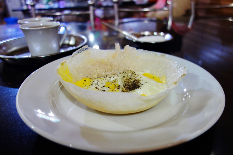 Rice pancake in the shape of a bowl with egg