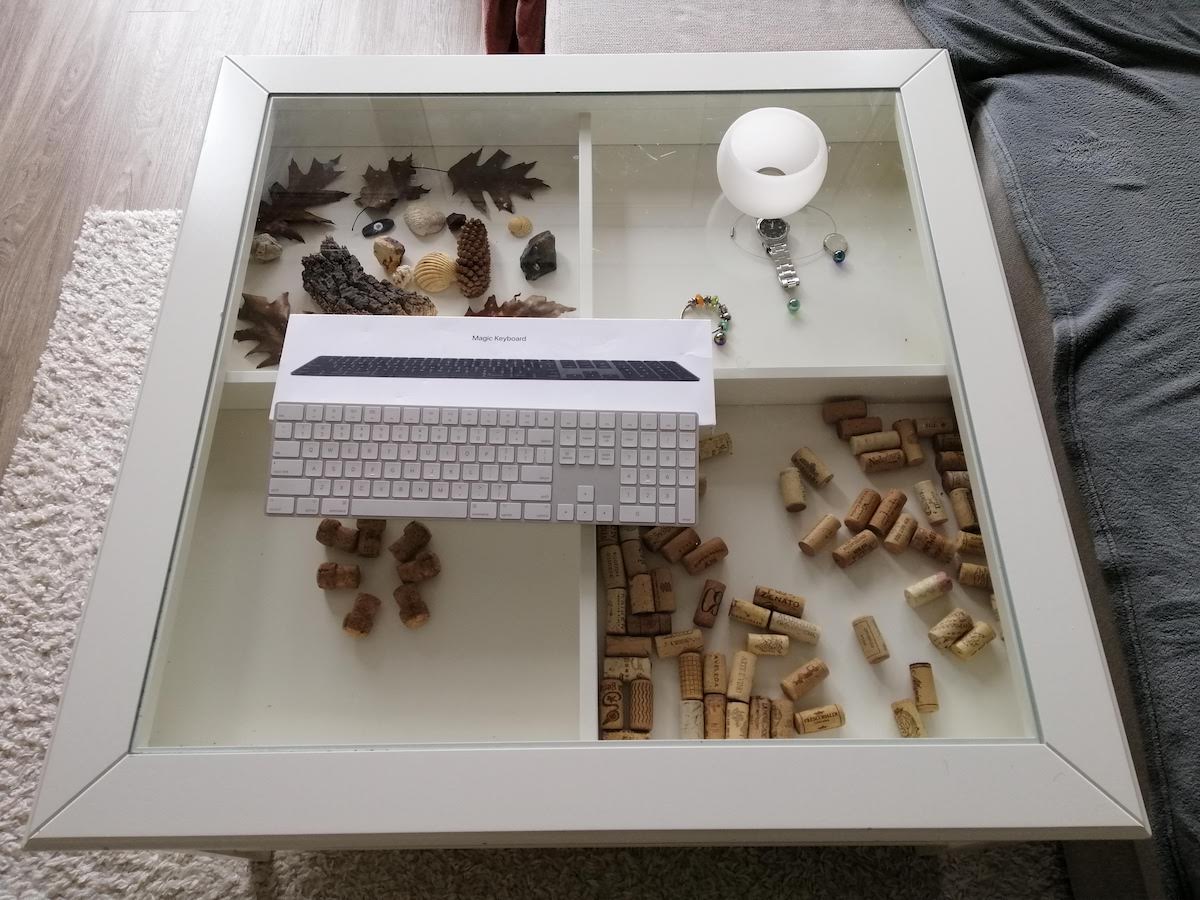 I wanted to show how our glass-topped table is slowly filling up with all sorts of little things.