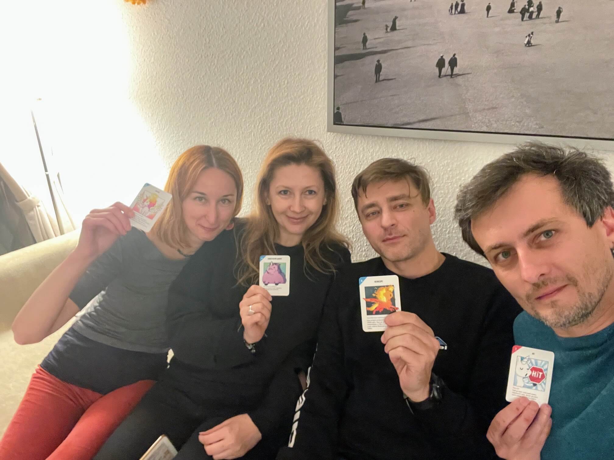 We, Alina and Zhenya. With cards from the game.