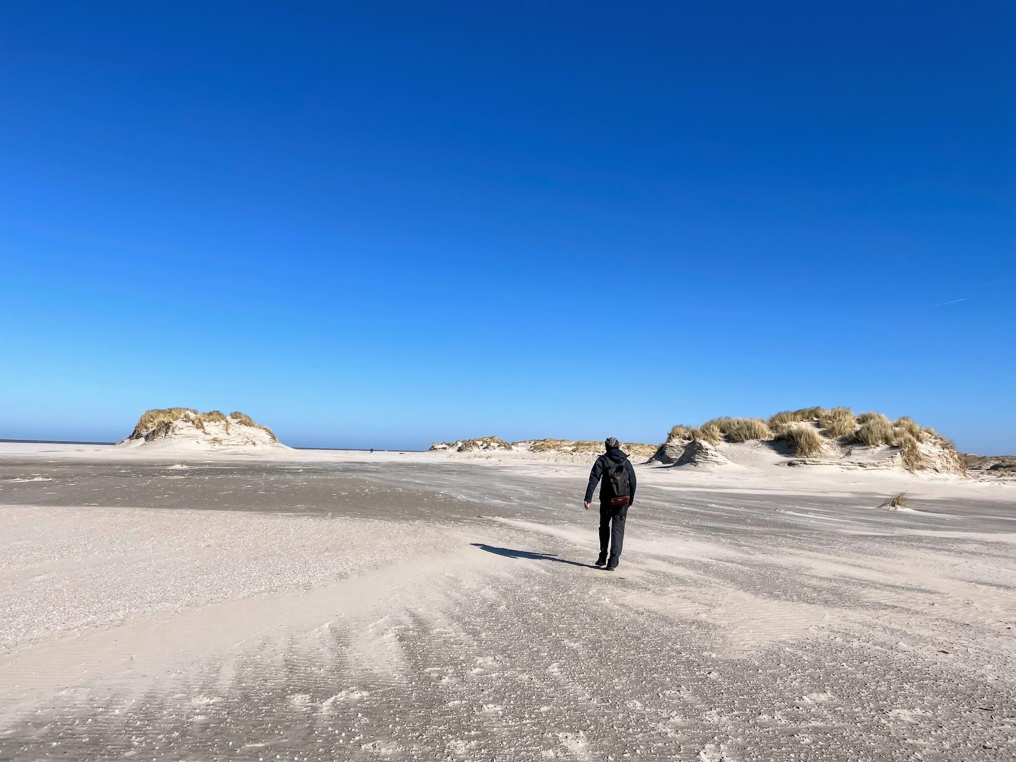 Snow-white beach with sandy dunes