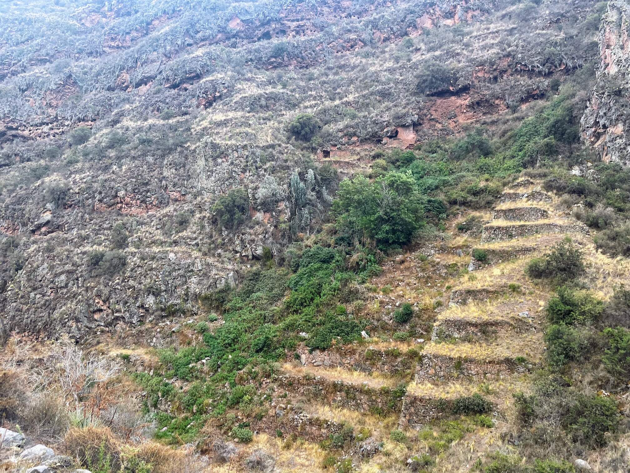 The holes in the mountain are hard to see in the photo