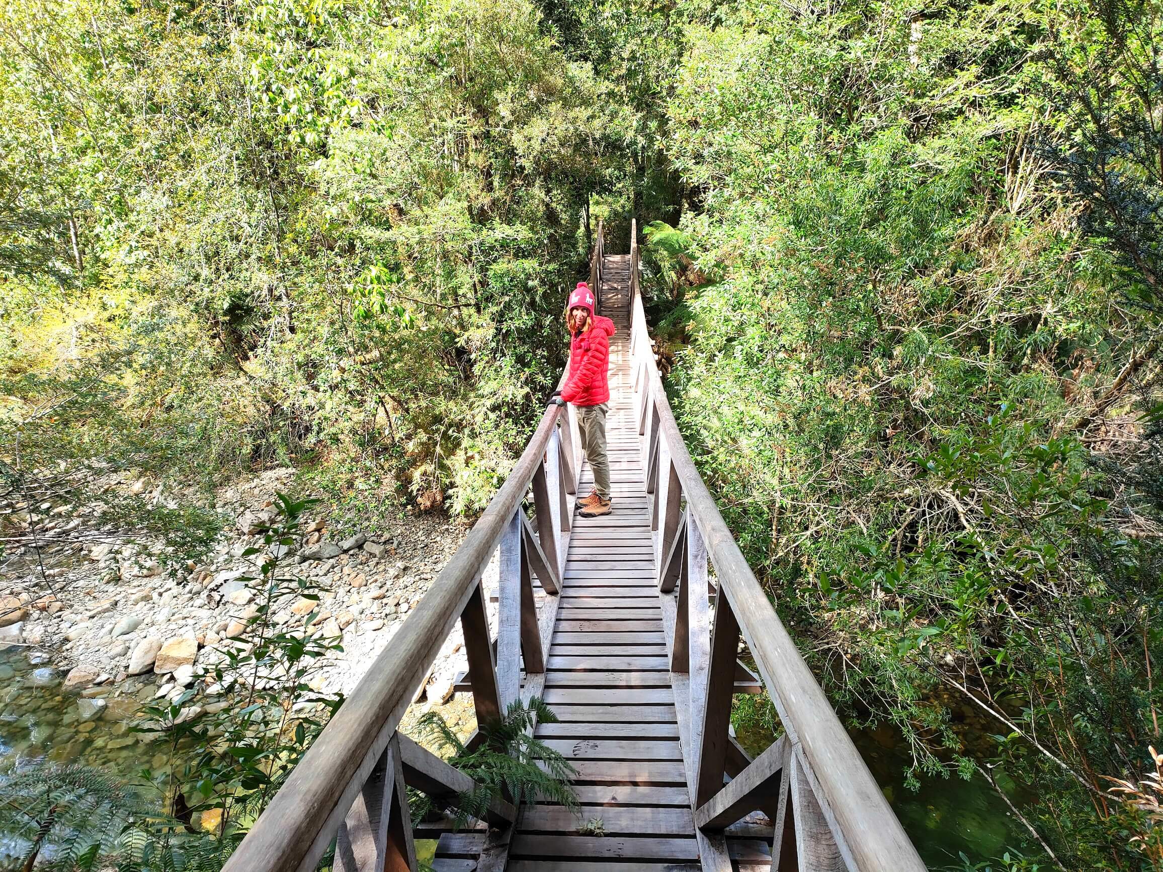 The park is very beautiful, with wooden paths. A bridge over the little river.