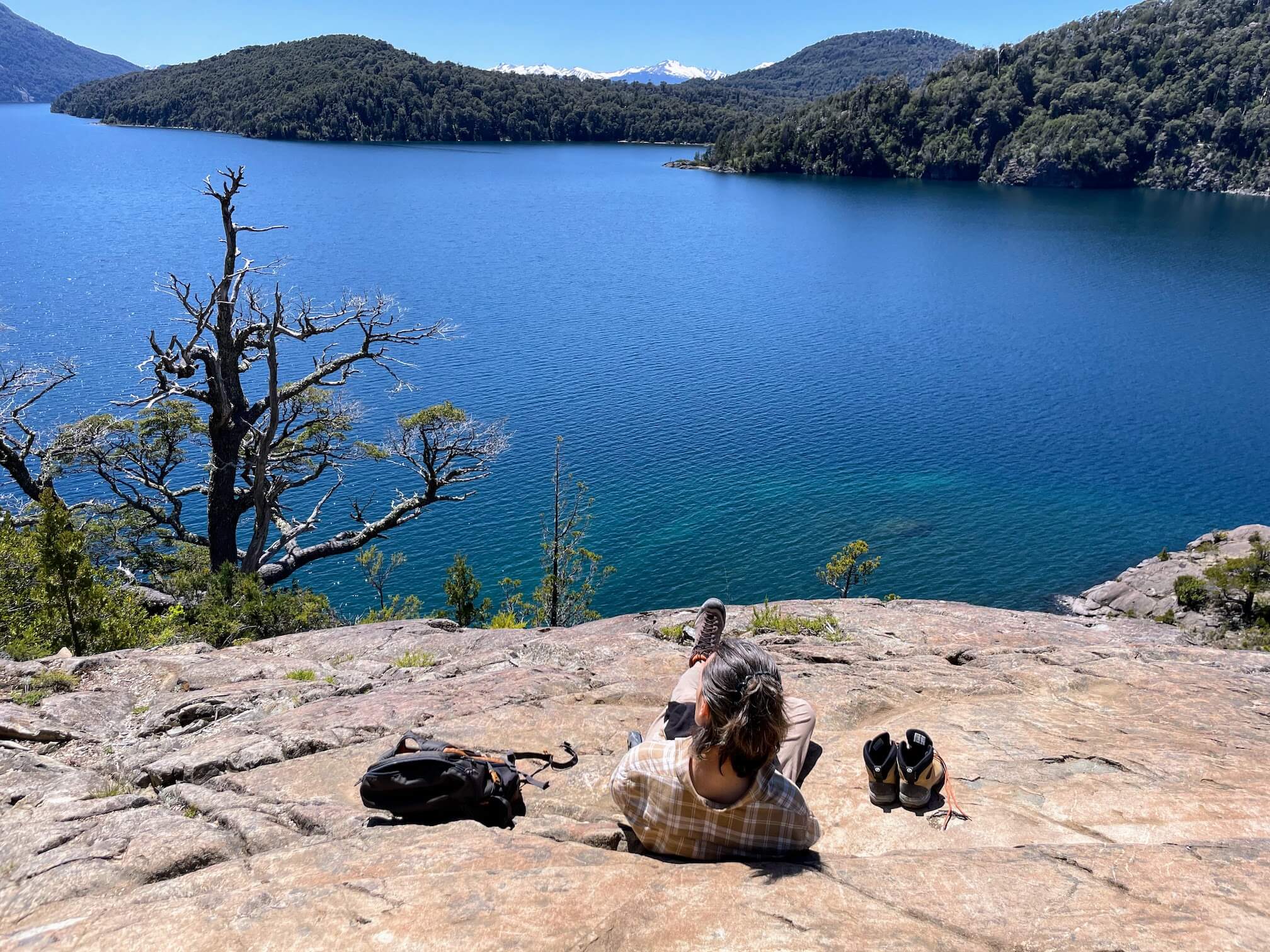 The third stop — we went for a walk to another viewpoint. We sat on a big rock overlooking the lake...